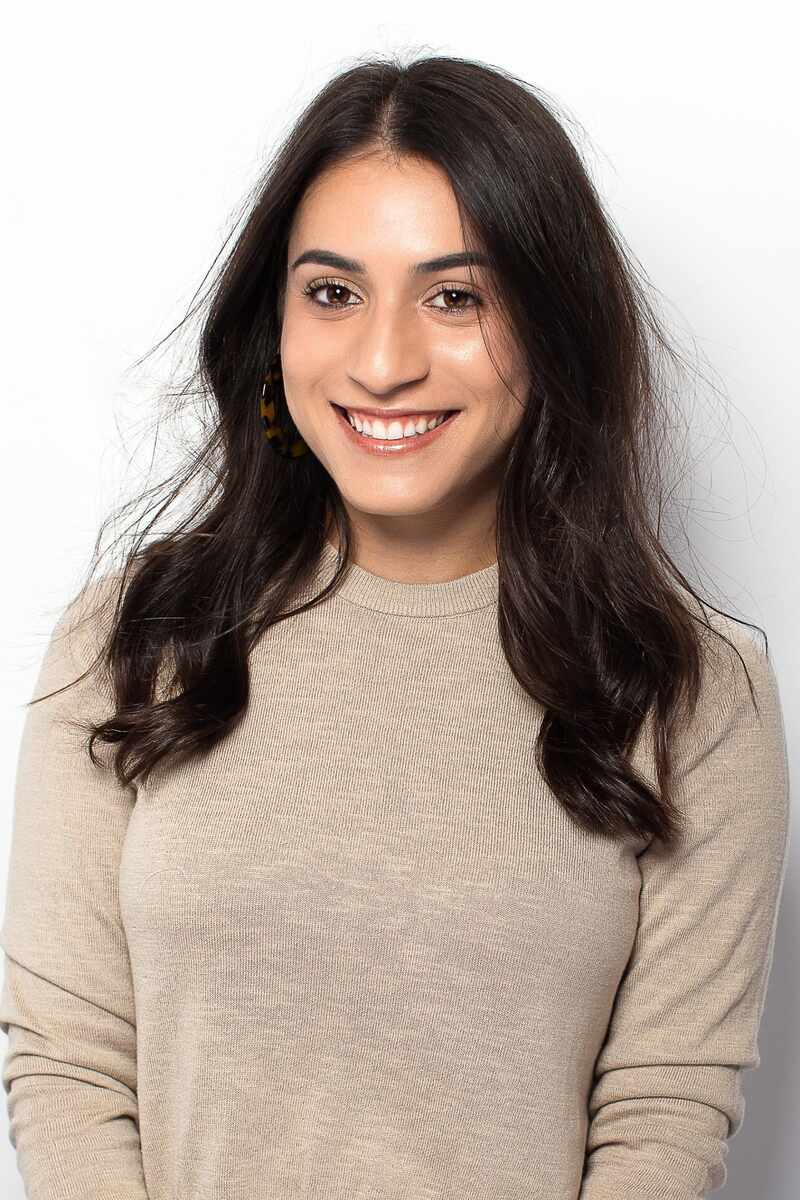 Hannah Bloom, wearing taupe shirt