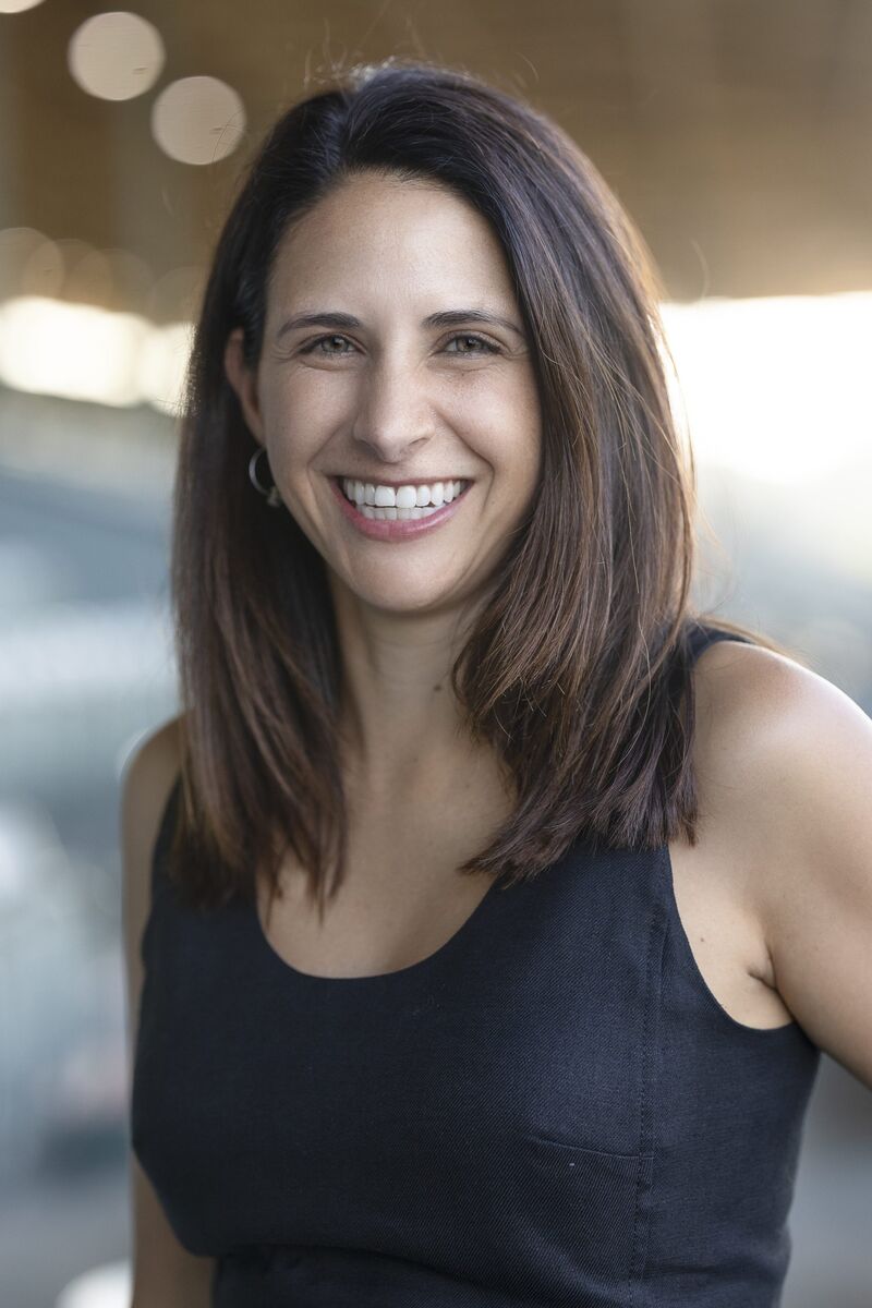 Dark haired woman in black sleeveless