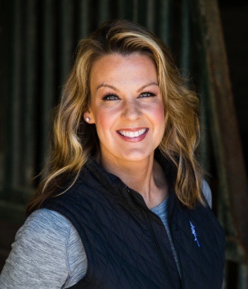 Kellie Hill in grey shirt and black vest