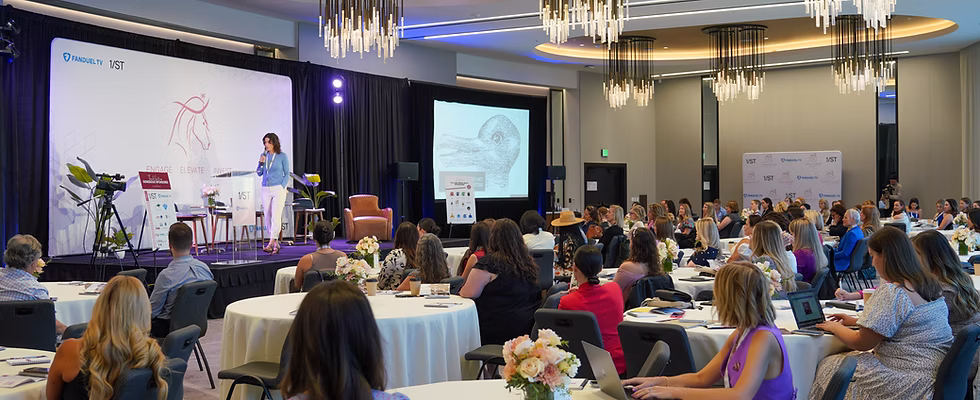Women sitting at tables during 2024 summit